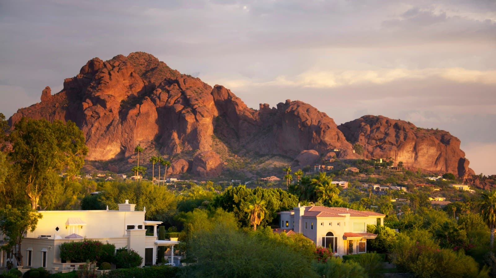 Camelback Mountain rising above Scottsdale homes at golden hour