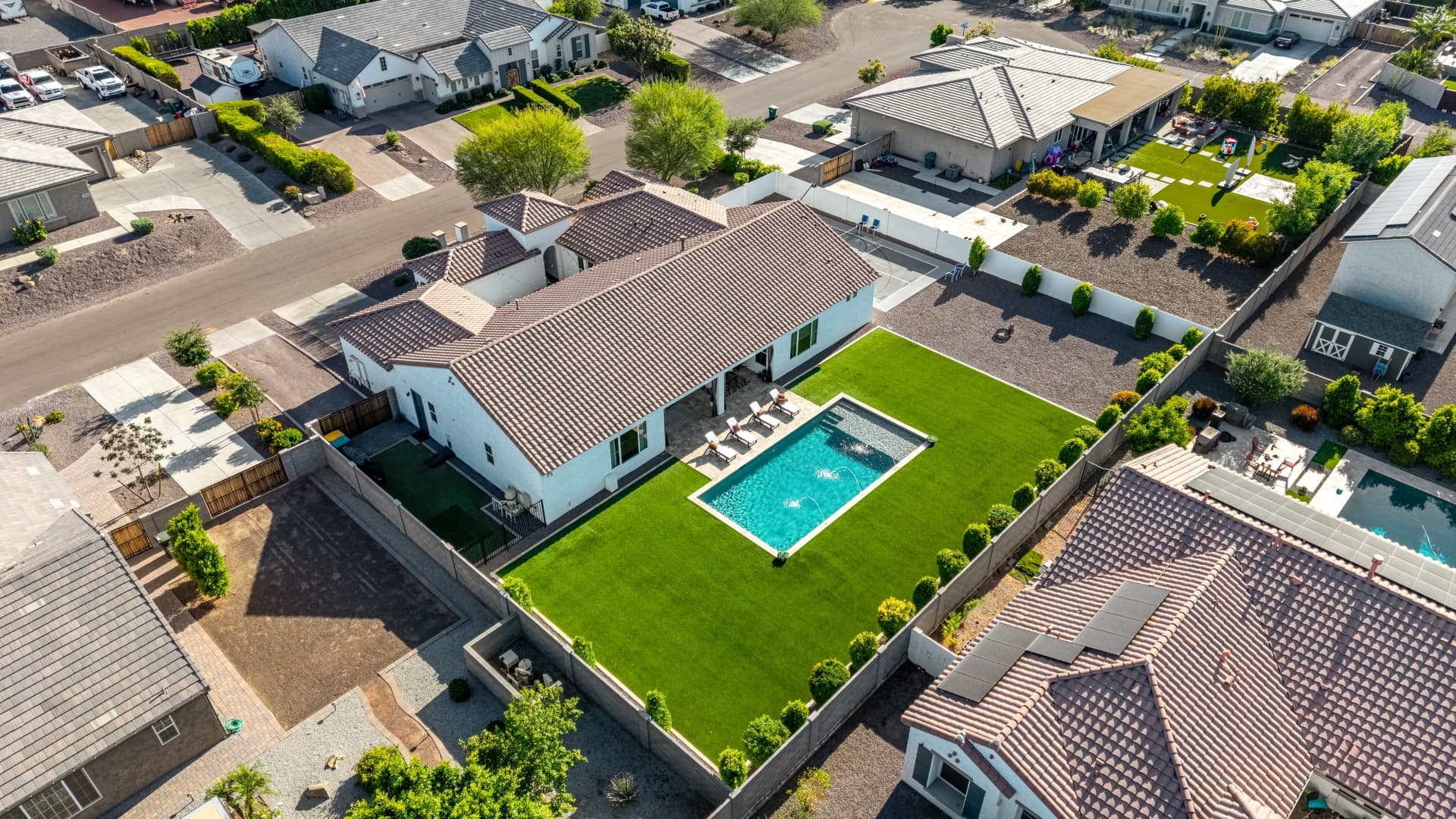 Aerial view of an Arizona luxury home, pool, and grounds
