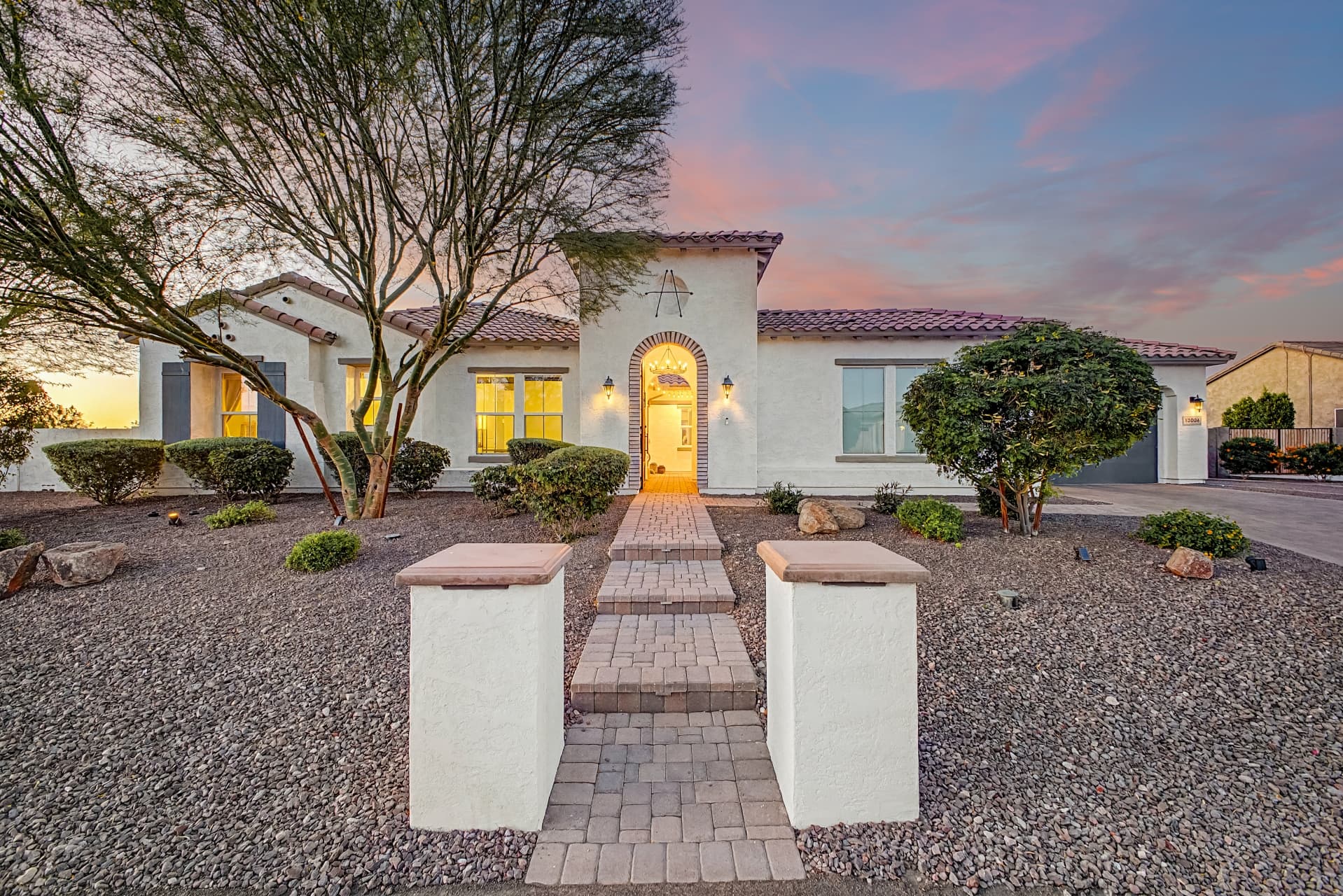 An Arizona luxury home with warm curb appeal at twilight